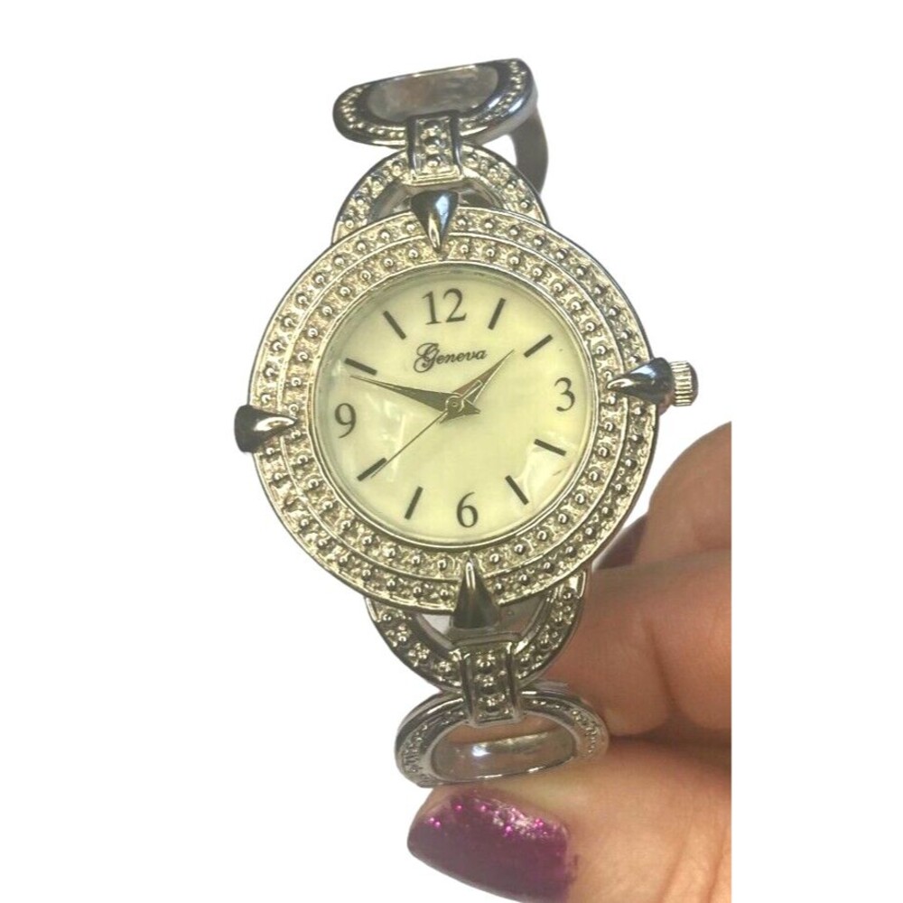 Geneva watch silvertone rigid spring cuff white opulent round face classic y2k